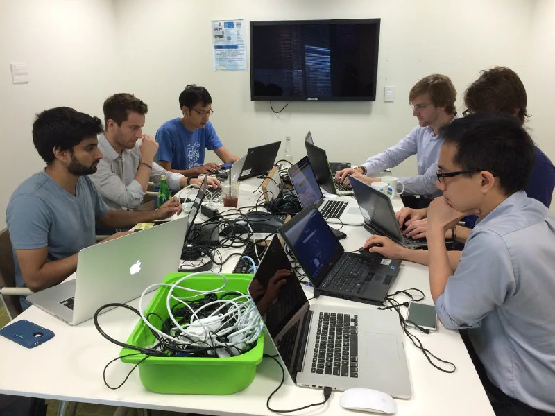 The Palantir Singapore FDE team debugging an outage (h/t Satej Soman for the photo)